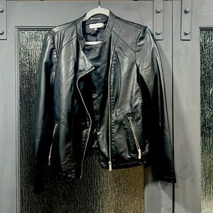 Barely worn,Soft faux leather silver zippers for pockets, arm sleeves &front zip